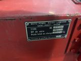 a close up of a sign on a red machine