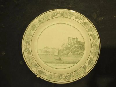 a plate with a picture of a castle on it