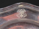 a silver plate with a decorative design on it