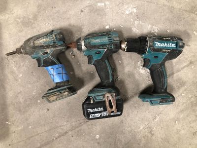 three makita cordless drillets are sitting on the floor