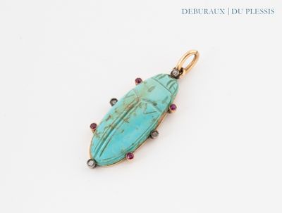 a close up of a turquoise stone pendant on a white surface
