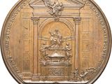 an image of a gold medal with a statue on top of it