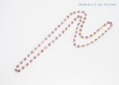 rosary necklace with amethorate beads on a white background