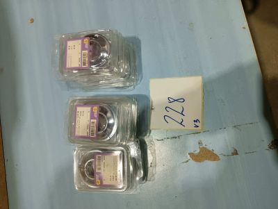 three empty plastic containers sitting on a blue table