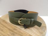 green leather belt with a gold buckle on a wooden board