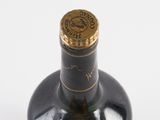 a bottle of wine that is sitting on a table