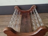 a wooden stand with a glass display on it