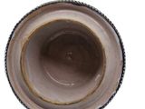a close up of a bowl on a white surface