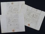 several old letters and envelopes with stamps on them on a black surface