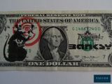 une image d'un billet d'un dollar sur lequel figure un rat