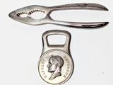 a silver spoon and a silver spoon with a coin on it