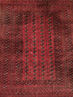 a red and black rug with a square design on it