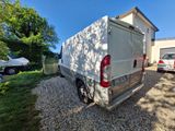 an image of a van parked in front of a house