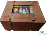 a cardboard box with a bunch of dvds inside of it