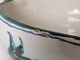 a close up of a bowl on a table