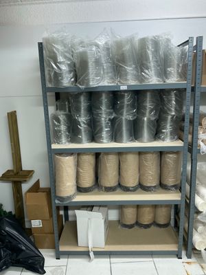 many rolls of thread on the shelves in the room