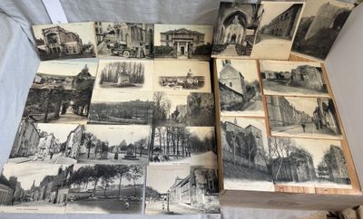 a lot of old black and white pictures on the table