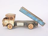 a small toy truck with a dumpster on the back
