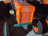 a tractor that is parked in a garage