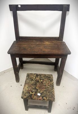 a wooden bench and a small stool in a room