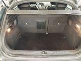 a trunk of a car that is empty with the door open