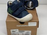 baby boy ' s navy blue and green sneakers with green star on the side
