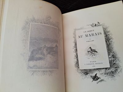 an open book with a picture of a bird on it