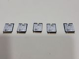 a close up of a row of four memory cards sitting on top of a table