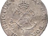a close up of a coin with a crown on it