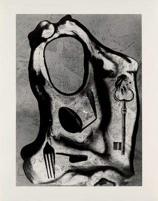 black and white photograph of a piece of art with a knife and fork on it