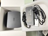 a box with a charger and a power cord in it