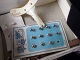 a box that has a bunch of studs in it