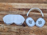 a pair of headphones and a sleeping mask on a wooden table