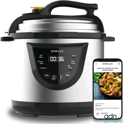 an electric pressure cooker with a smart phone next to it
