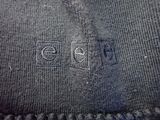 someone is stitching a piece of fabric with a needle