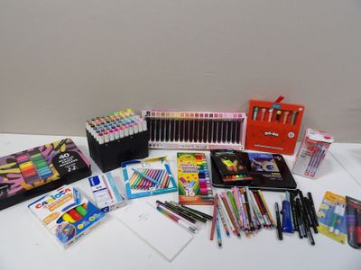 a lot of school supplies sitting on a table