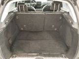 a trunk of a car with the back seats folded down