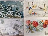 four postcards of christmas cards with pictures of animals and trees