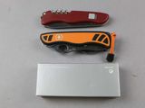 three different types of knives on a table next to a hard drive