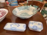 three bowls and a bowl on a wooden table
