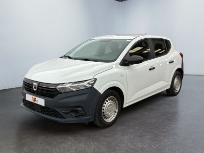 the white car is parked in a large room with a black floor