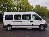 a white van parked in a parking lot with trees in the background