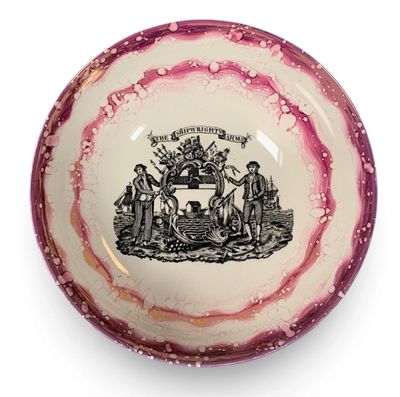 a pink and white bowl with a black and white picture on it