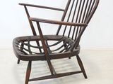 an image of a wooden chair in a white room