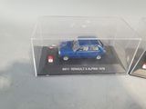two models of a blue car in a clear display case