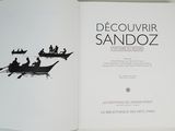 an open book with a picture of people in a boat