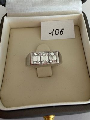 a ring that is in a box with a price tag on it