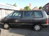 a black van parked in front of a building