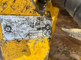a close up of a piece of metal on a piece of wood