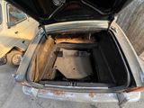 a trunk of a car with a seat in it